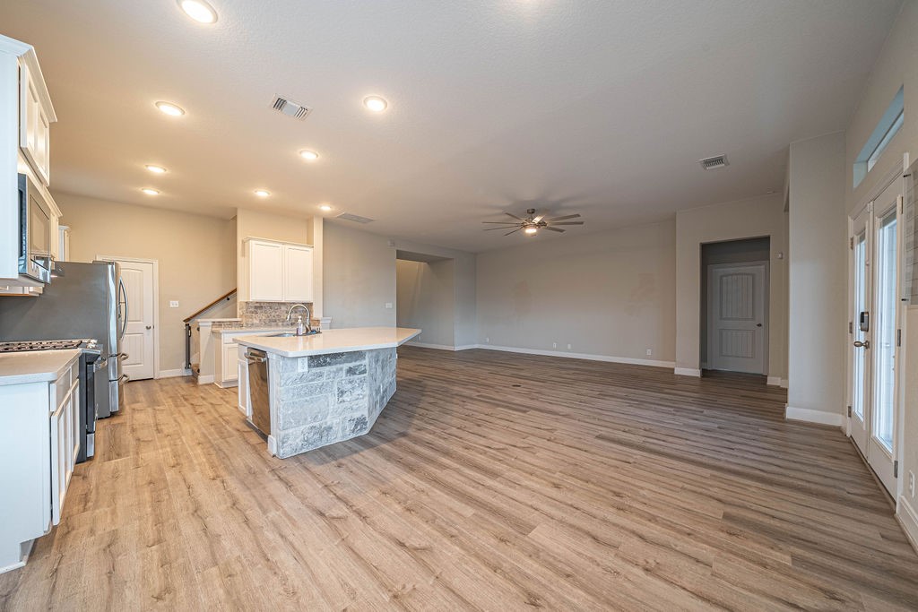 830 Rench New Braunfels, TX 78130 - Photo 9 of 50 a view of a kitchen and wooden floor