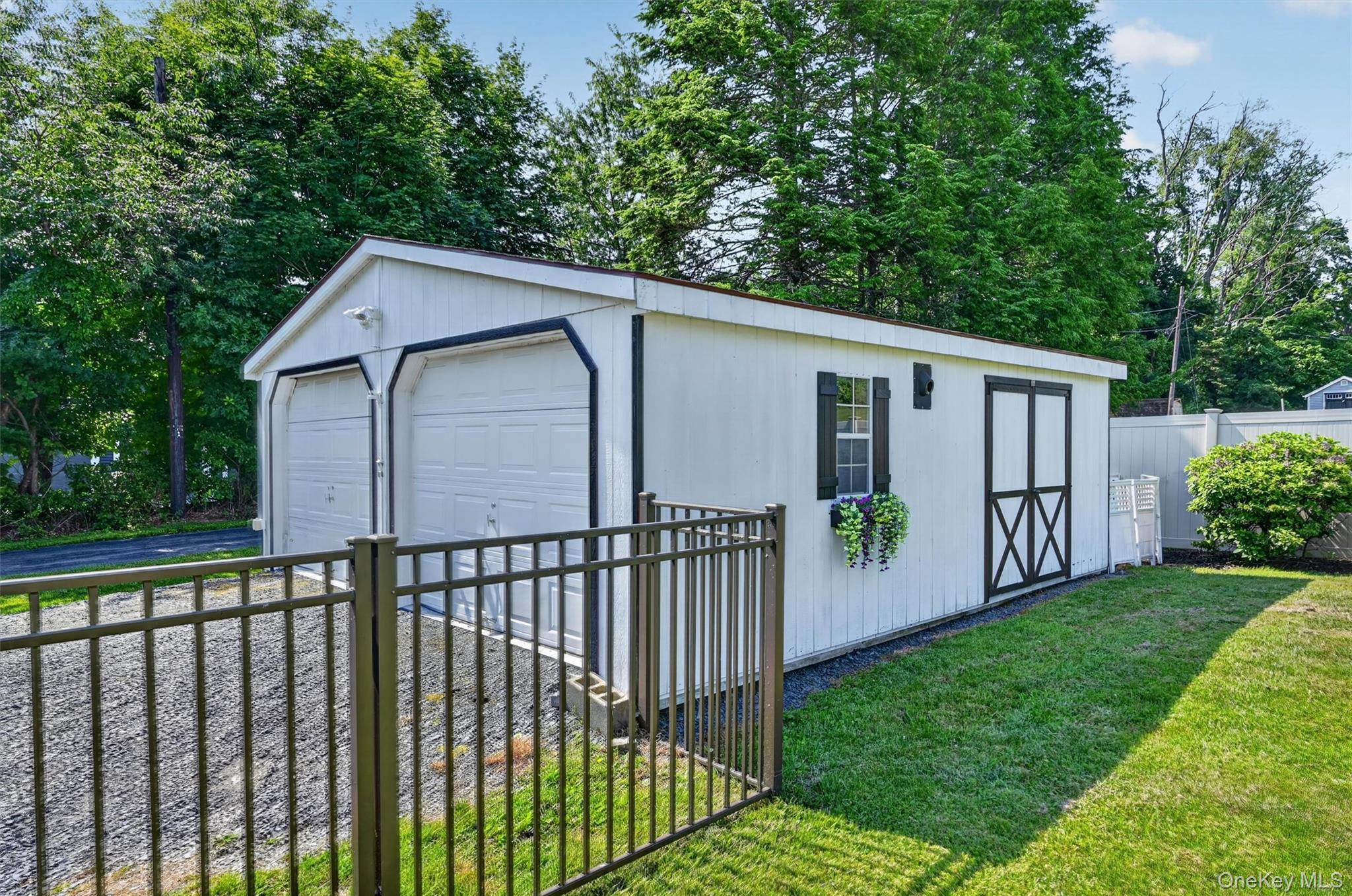 5 Hedges Road Warwick, NY 10990 - Photo 38 of 48 The insulated detached garage with electric is located on the opposite side of the home from the attached garage, offering excellent space for vehicle storage, seasonal items, yard equipment, or a workshop.