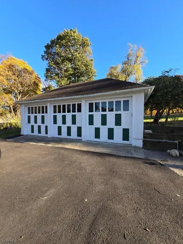 a view of a house with a backyard and balcony