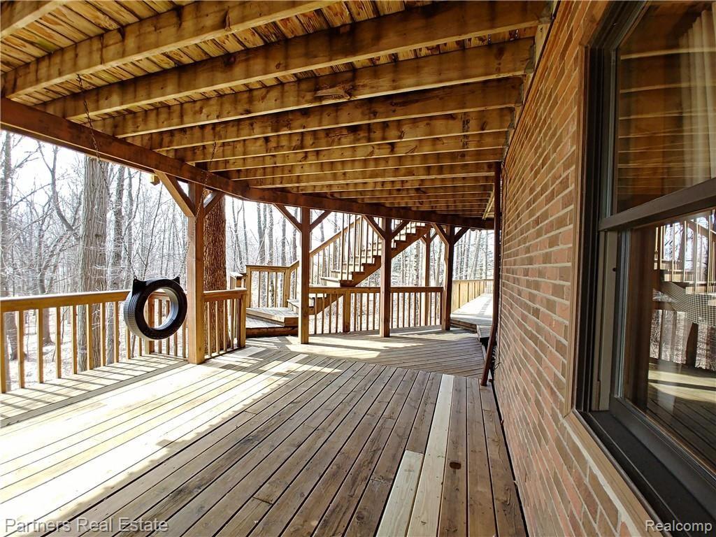 2715 West Coon Lake Road Howell, MI 48843 - Photo 43 of 54 17f. Walkout leads to an Amazing Multi Level Deck offering views from both the main & lower levels.