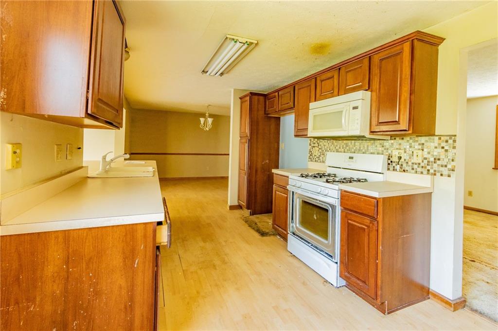 31 Hones Road Export, PA 15632 - Photo 11 of 22 a kitchen with stainless steel appliances a stove a sink and a refrigerator