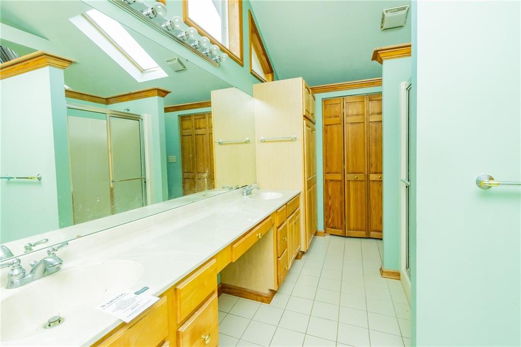 31 Hones Road Export, PA 15632 - Photo 17 of 22 a bathroom with a bathtub and a shower