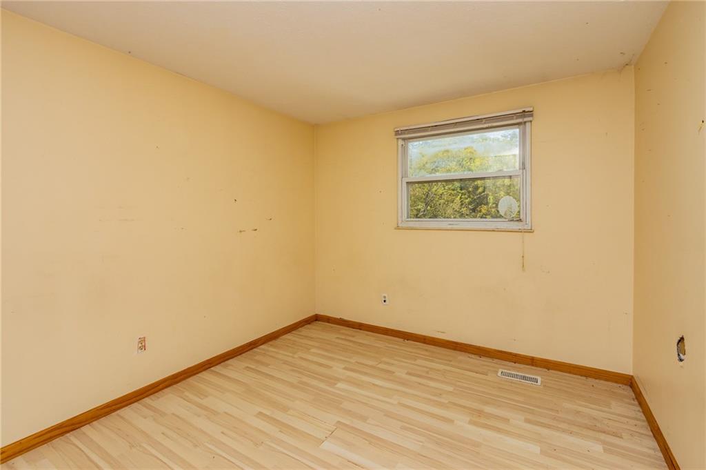 31 Hones Road Export, PA 15632 - Photo 18 of 22 a view of an empty room with wooden floor and a window