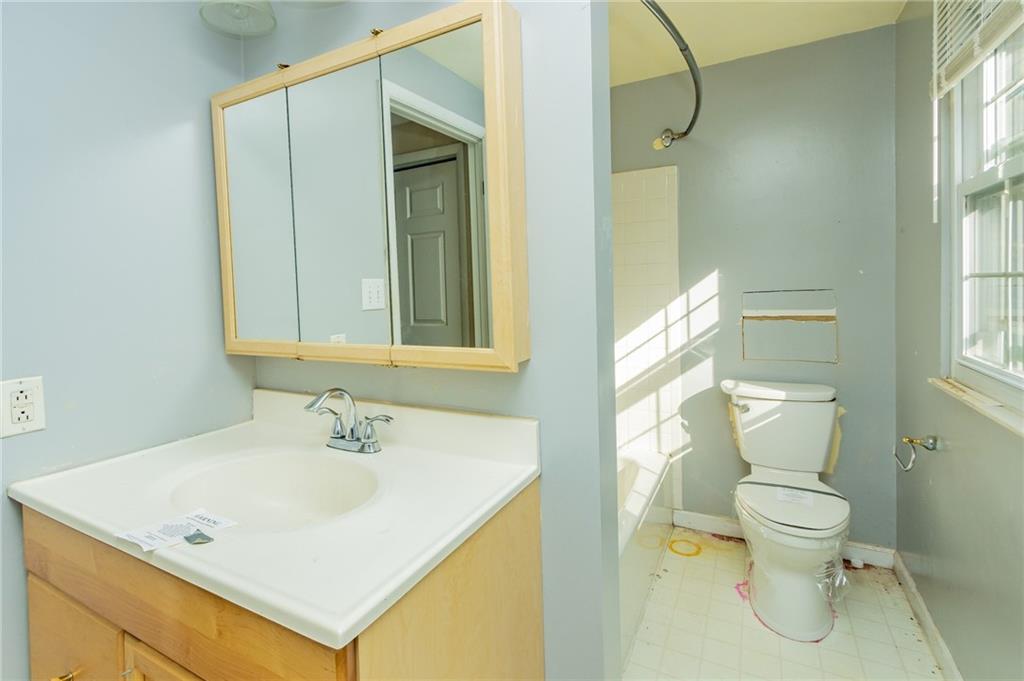 31 Hones Road Export, PA 15632 - Photo 22 of 22 a bathroom with a sink a toilet and a mirror