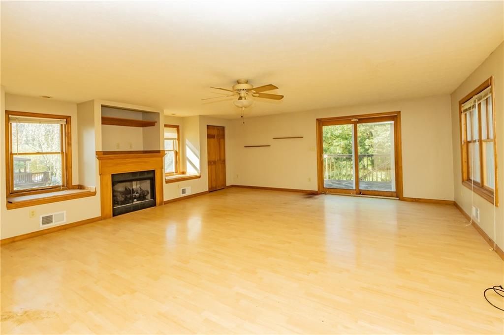 31 Hones Road Export, PA 15632 - Photo 8 of 22 a view of an empty room with a fireplace and a window