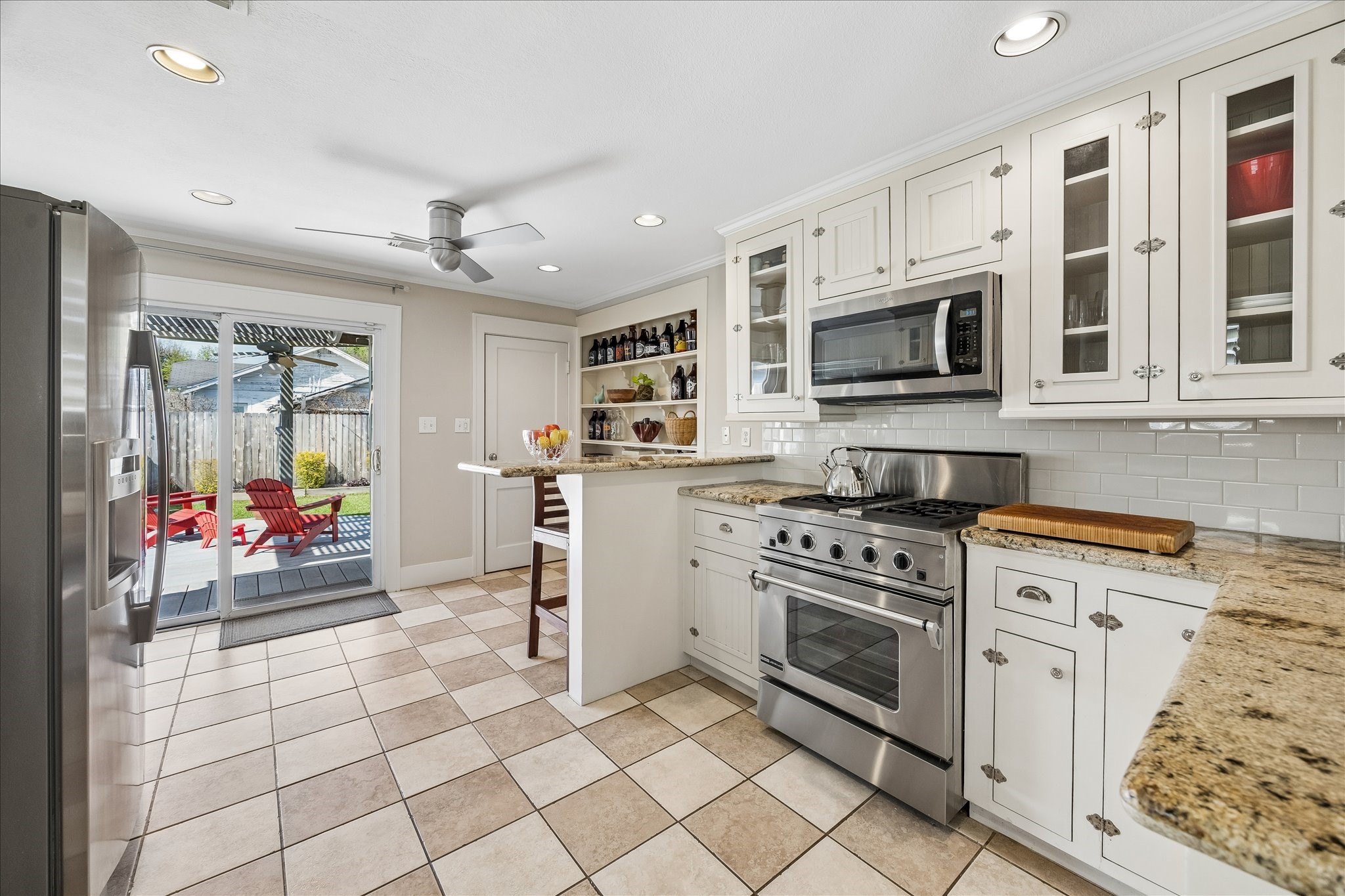 919 Key Street Houston, TX 77009 - Photo 12 of 39 A well-appointed kitchen featuring granite countertops, stainless steel appliances, and custom cabinetry. Designed for both everyday functionality and effortless entertaining.