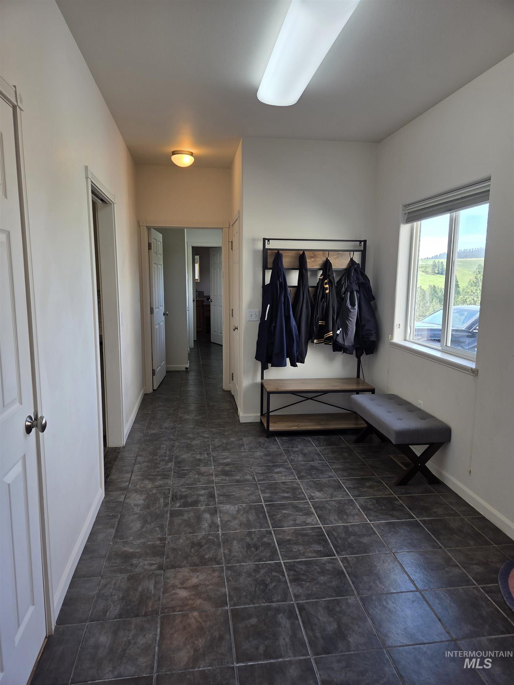 1085 Wallen Road Moscow, ID 83843 - Photo 8 of 50 Spacious entryway with dark grey tile flooring