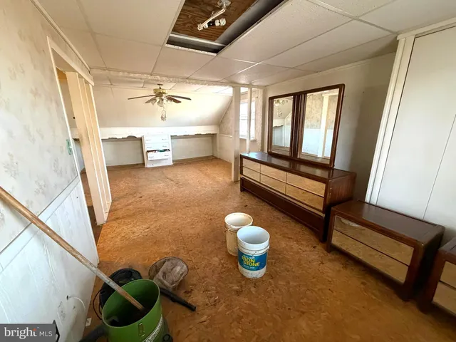 a view of a livingroom with furniture a fireplace