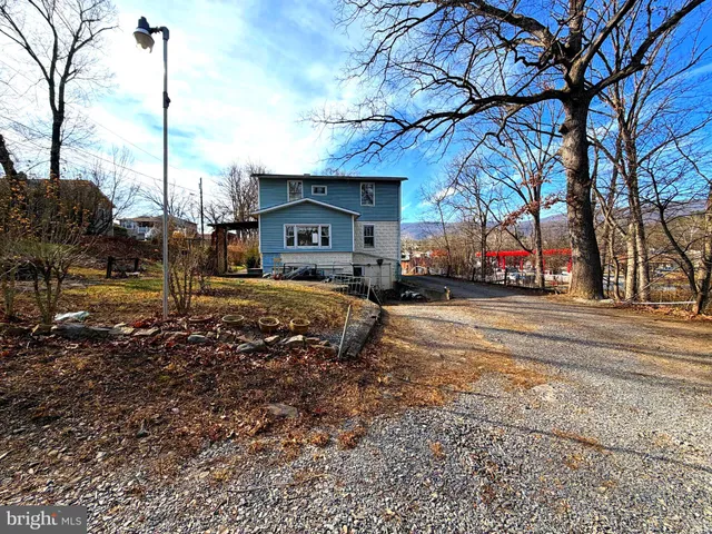 a view of a town with barn house