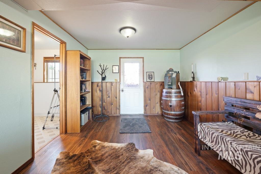 3828 15th Street Lewiston, ID 83501 - Photo 19 of 34 Foyer entrance featuring plenty of natural light, dark wood finished floors, wainscoting, and wooden walls