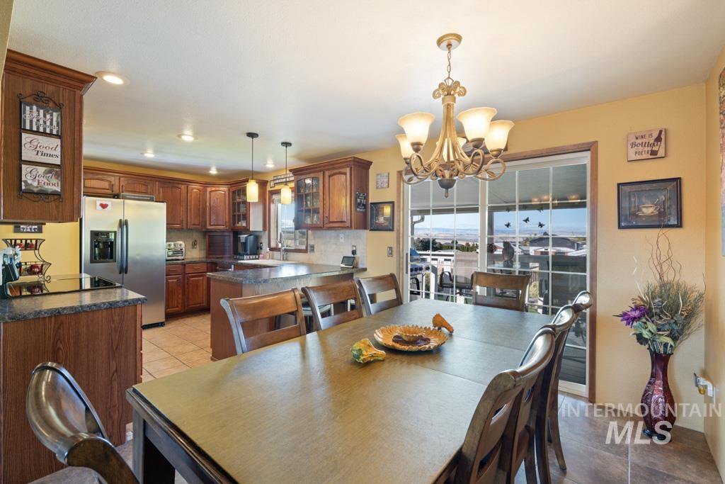 3828 15th Street Lewiston, ID 83501 - Photo 8 of 34 Dining area featuring light tile patterned floors, a chandelier, and recessed lighting