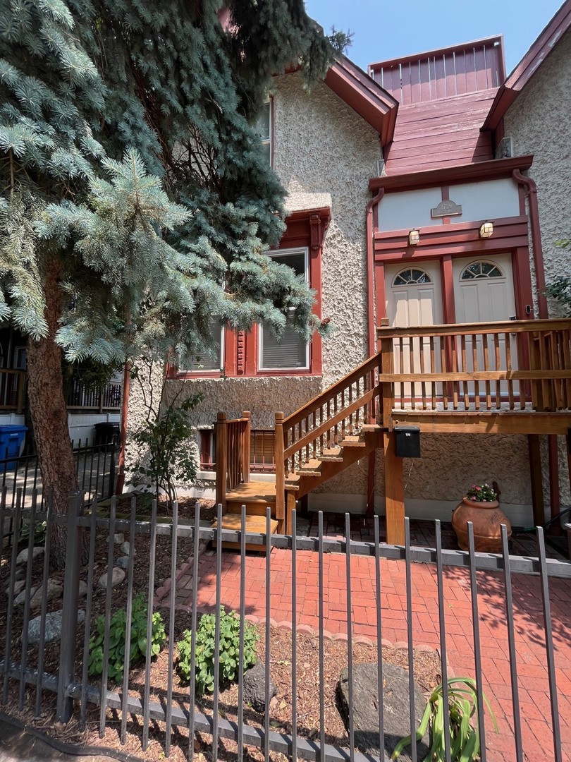 2729 North Racine Avenue, Unit N Chicago, IL 60614 - Photo 1 of 21 a balcony view with a large garden space