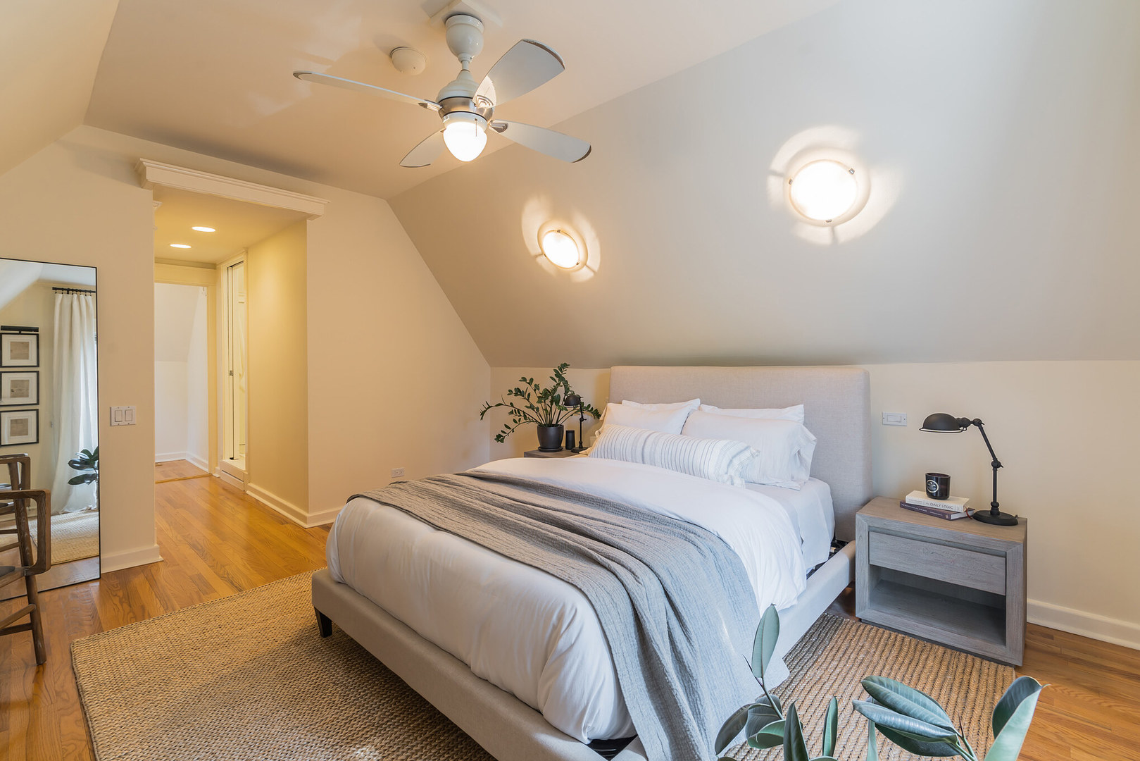 2729 North Racine Avenue, Unit N Chicago, IL 60614 - Photo 13 of 21 a bedroom with a bed and a chandelier