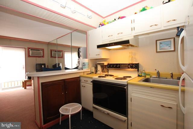 29 Maryland Avenue Rehoboth Beach, DE 19971 - Photo 3 of 4 a kitchen with a sink cabinets and appliances