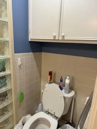 a bathroom with a toilet and a sink