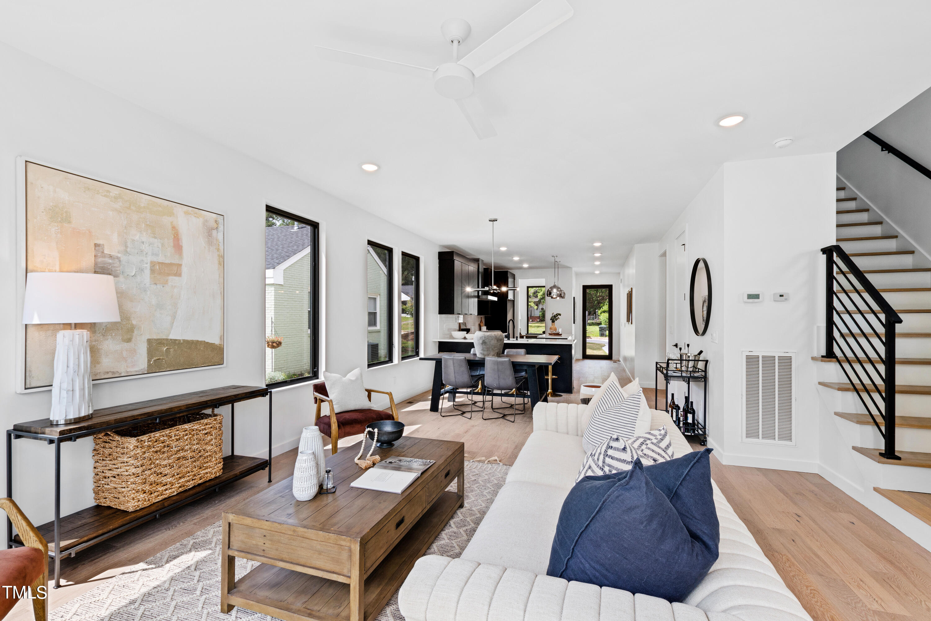 716 Brighton Road, Unit 102 Raleigh, NC 27610 - Photo 11 of 78 a living room with furniture a rug and a large window