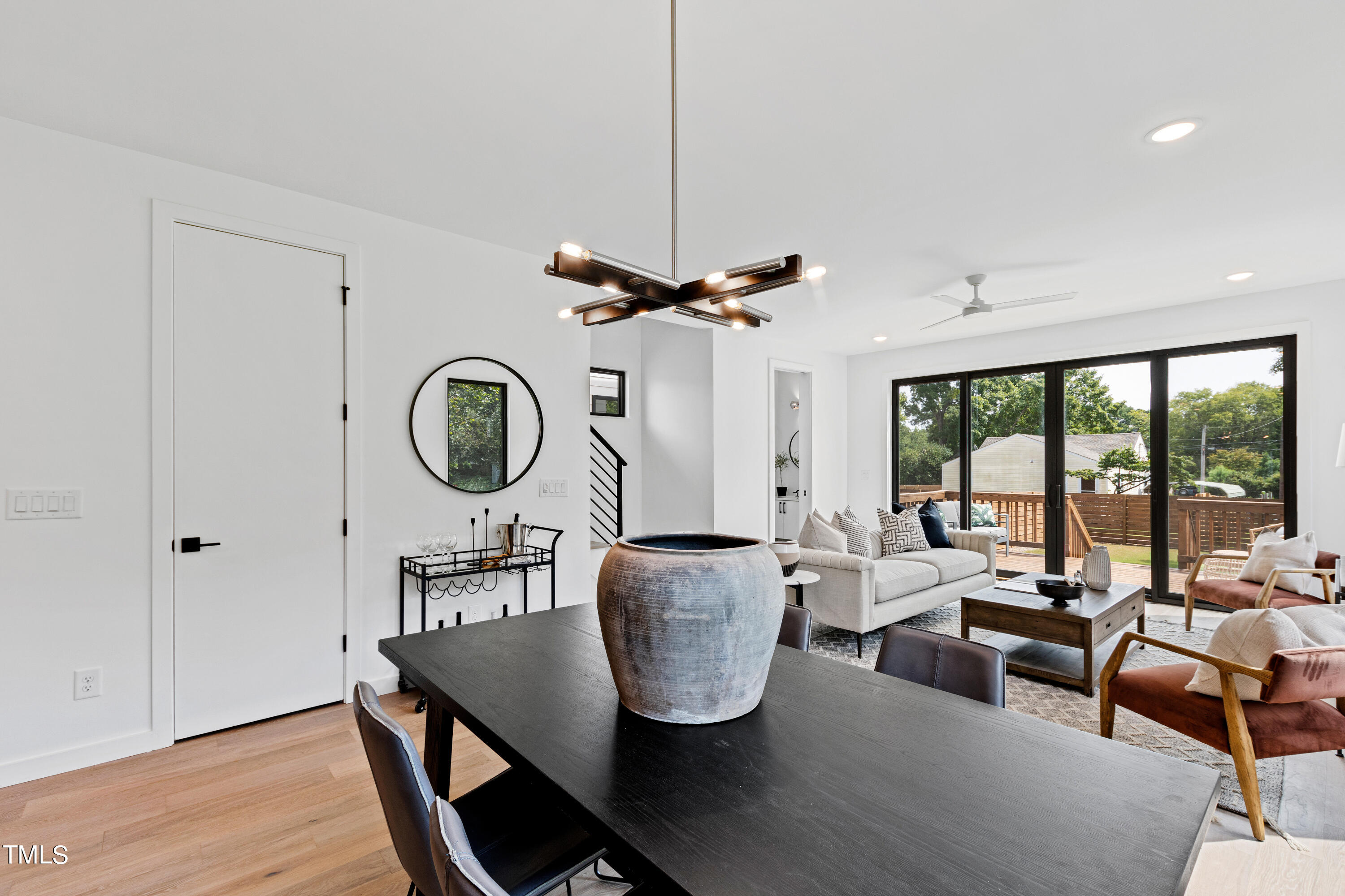716 Brighton Road, Unit 102 Raleigh, NC 27610 - Photo 18 of 78 a living room with furniture a window and a chandelier