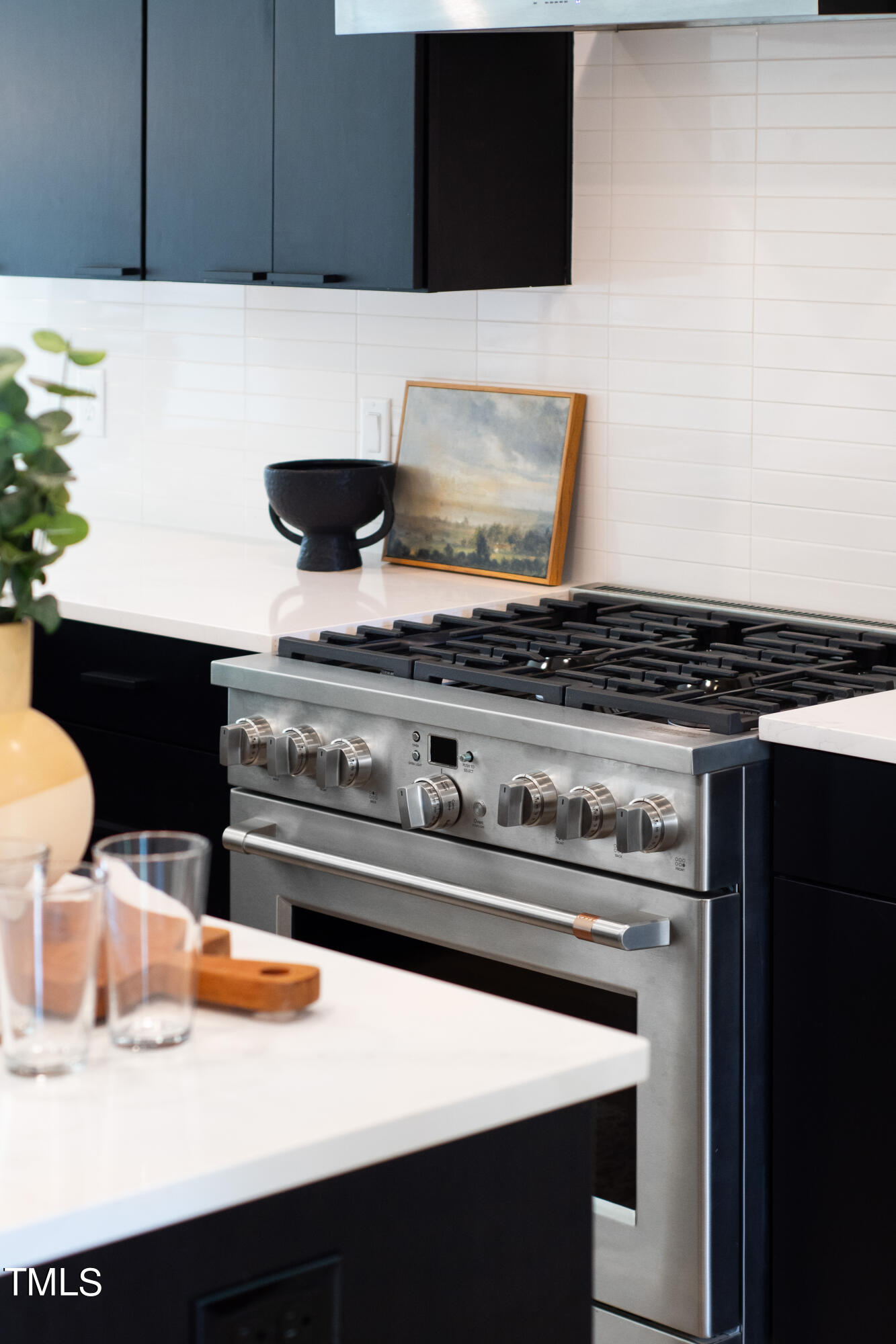 716 Brighton Road, Unit 102 Raleigh, NC 27610 - Photo 30 of 78 a stove top oven sitting inside of a kitchen
