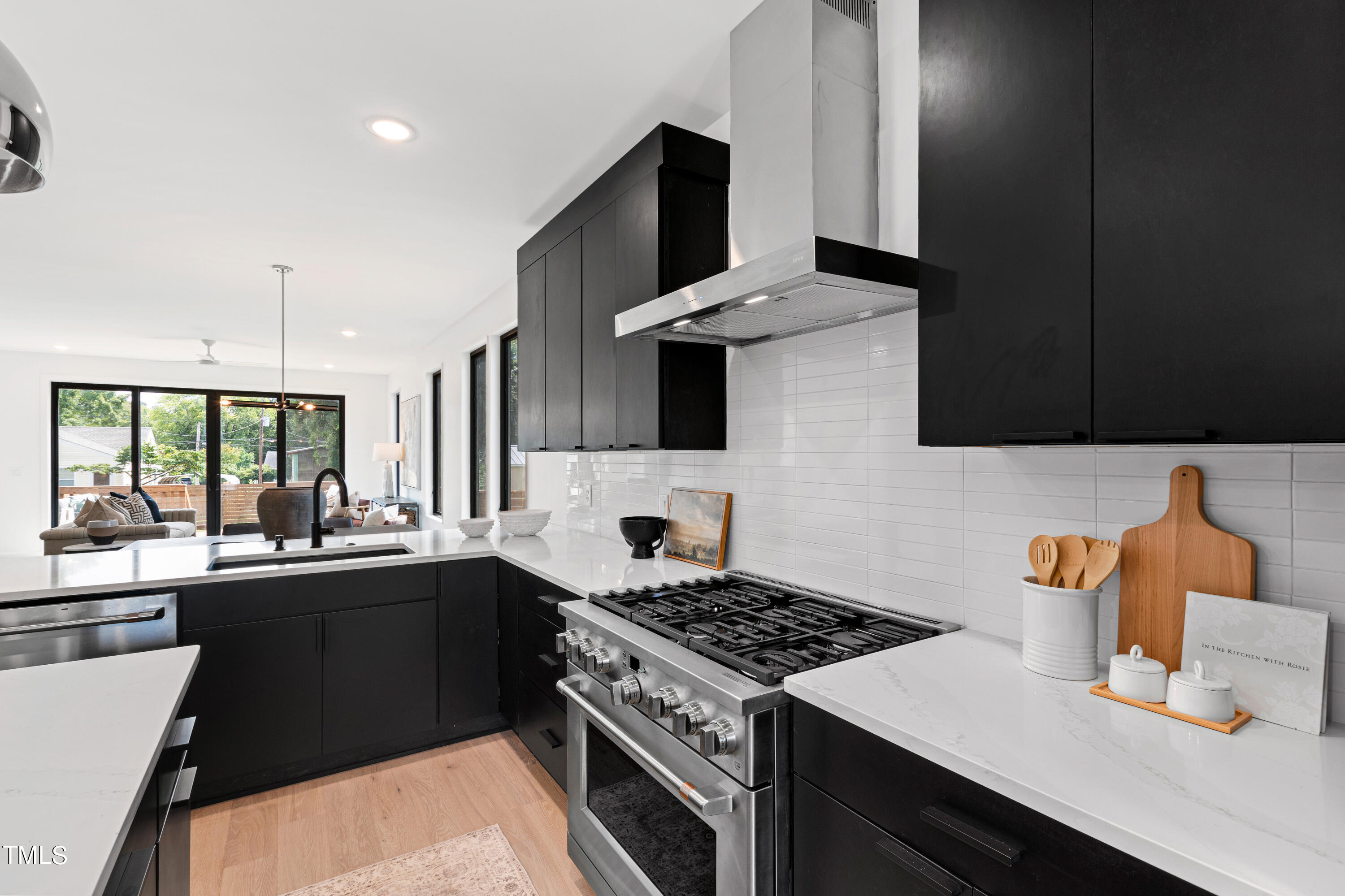 716 Brighton Road, Unit 102 Raleigh, NC 27610 - Photo 31 of 78 a kitchen with a sink stove and microwave
