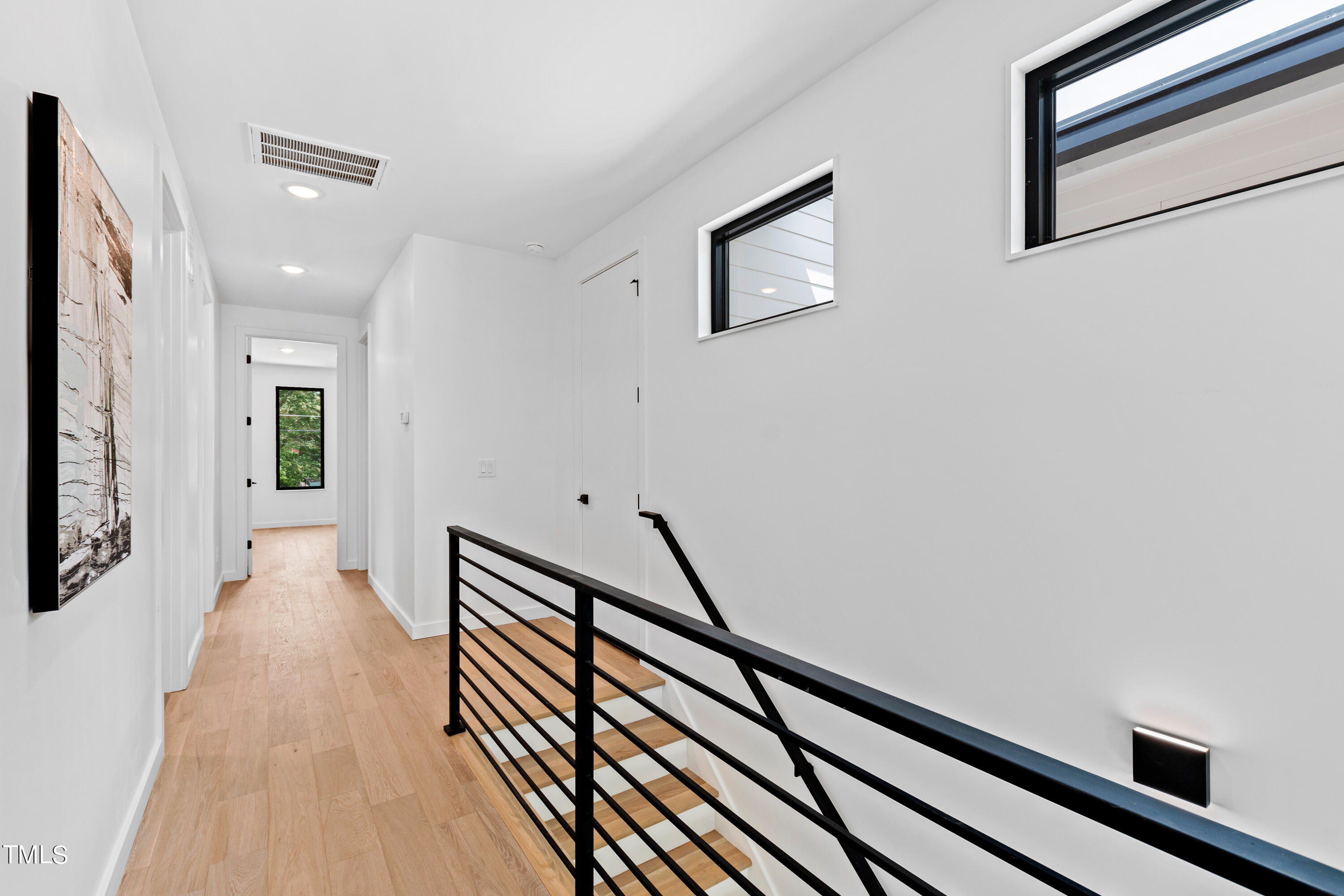716 Brighton Road, Unit 102 Raleigh, NC 27610 - Photo 37 of 78 a view of gallery with wooden floor