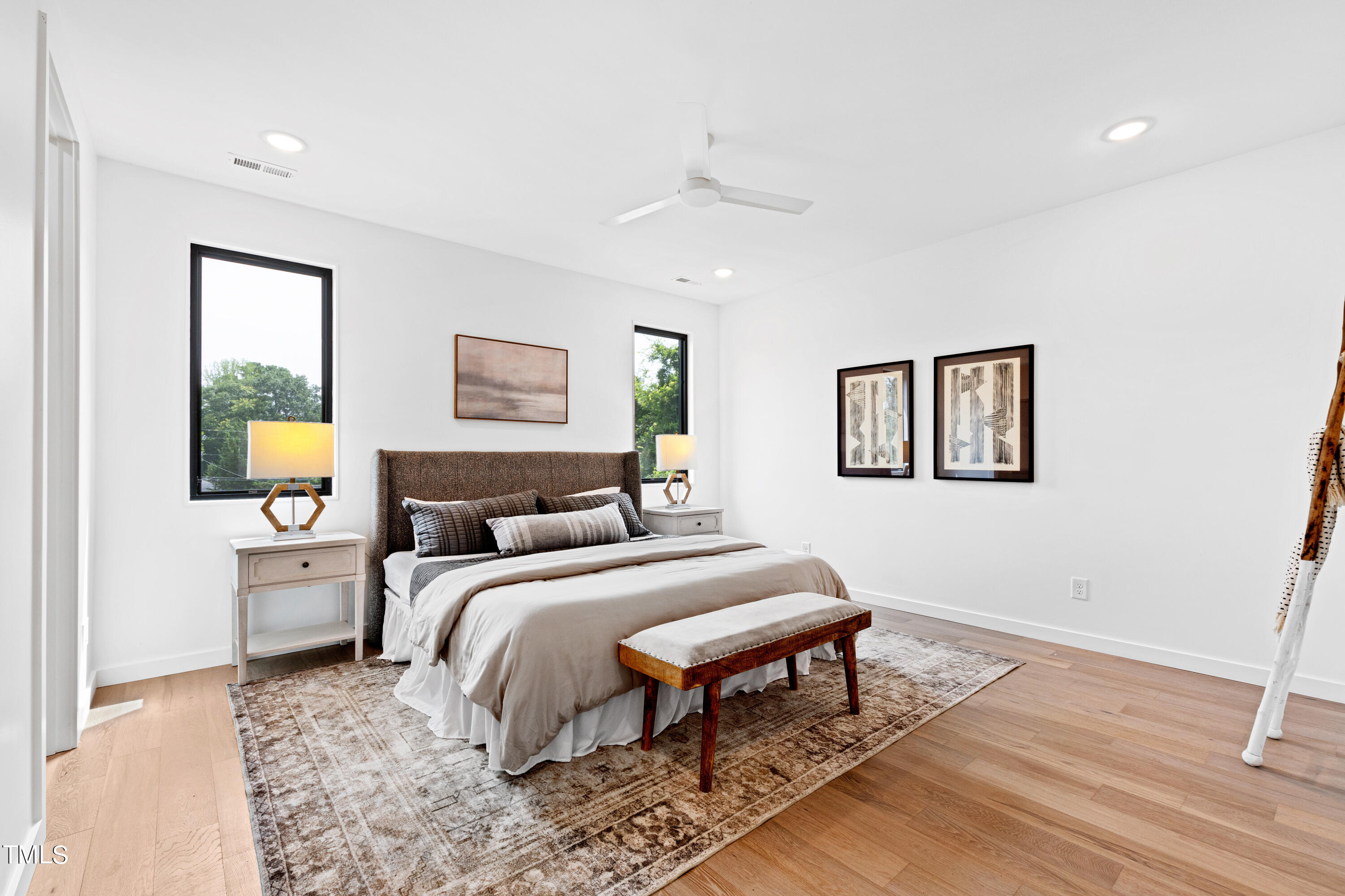716 Brighton Road, Unit 102 Raleigh, NC 27610 - Photo 38 of 78 a bedroom with a bed and a painting on the wall