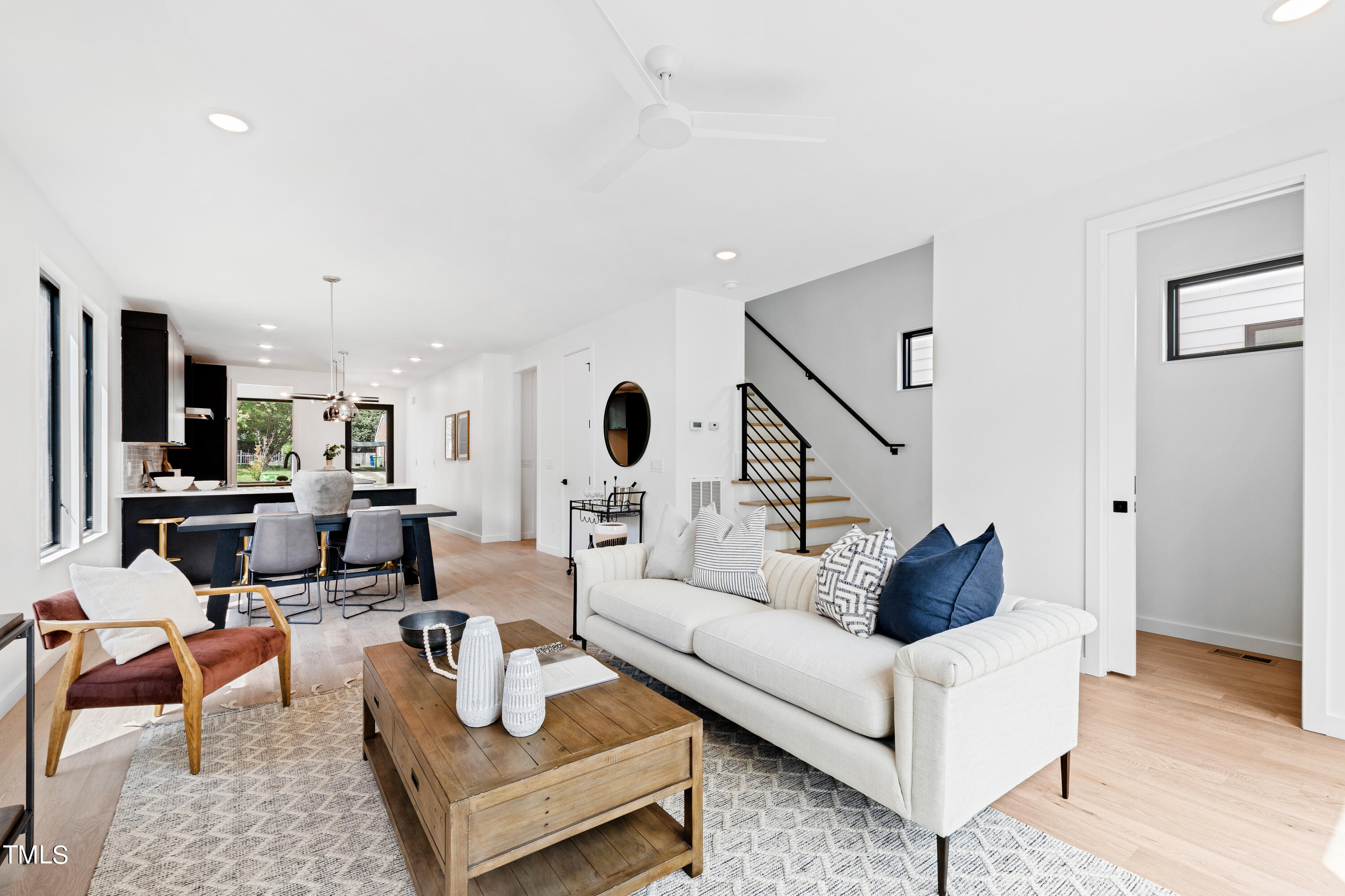 716 Brighton Road, Unit 102 Raleigh, NC 27610 - Photo 4 of 78 a living room with furniture and wooden floor