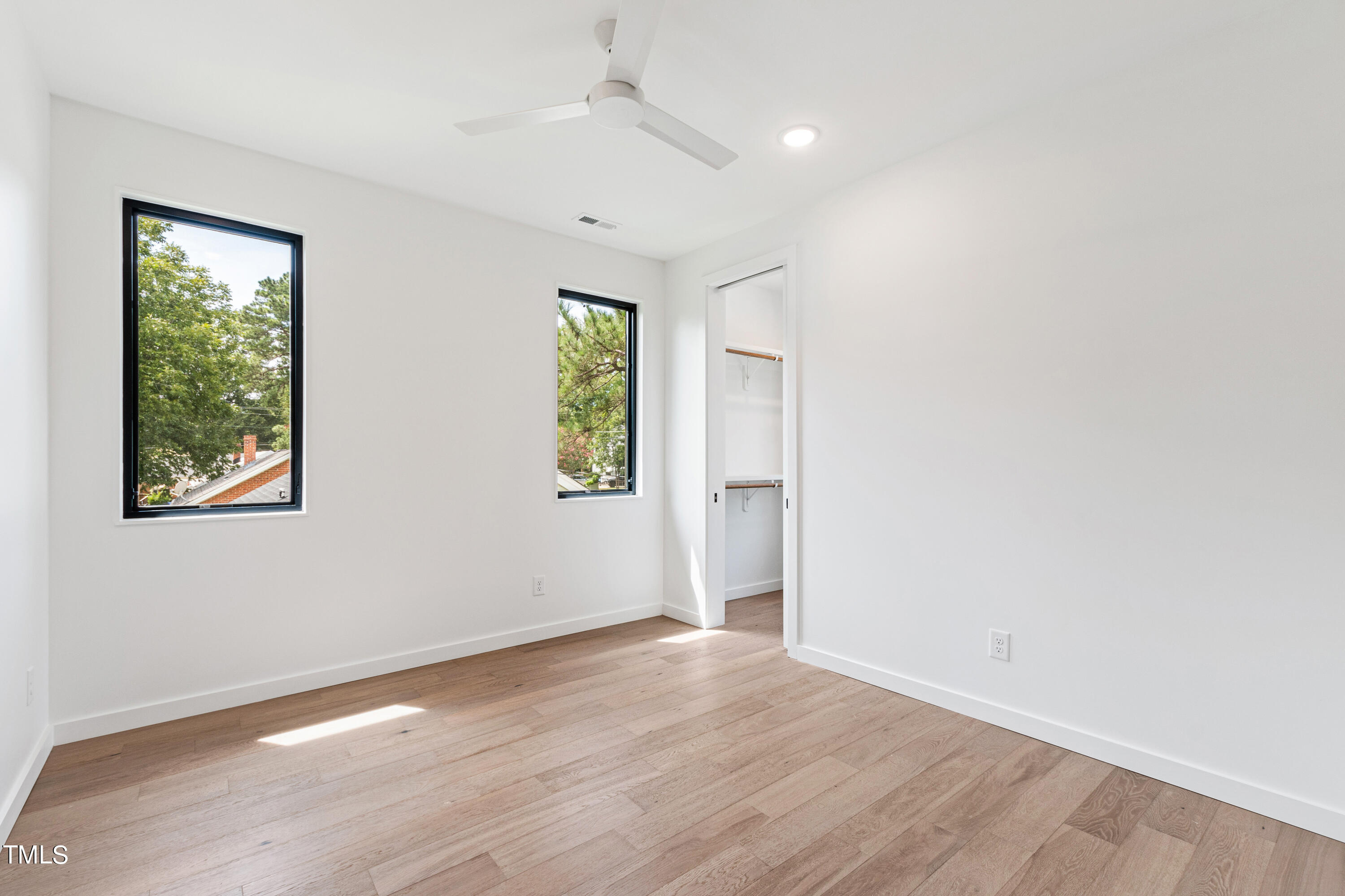 716 Brighton Road, Unit 102 Raleigh, NC 27610 - Photo 53 of 78 wooden floor in an empty room with a window