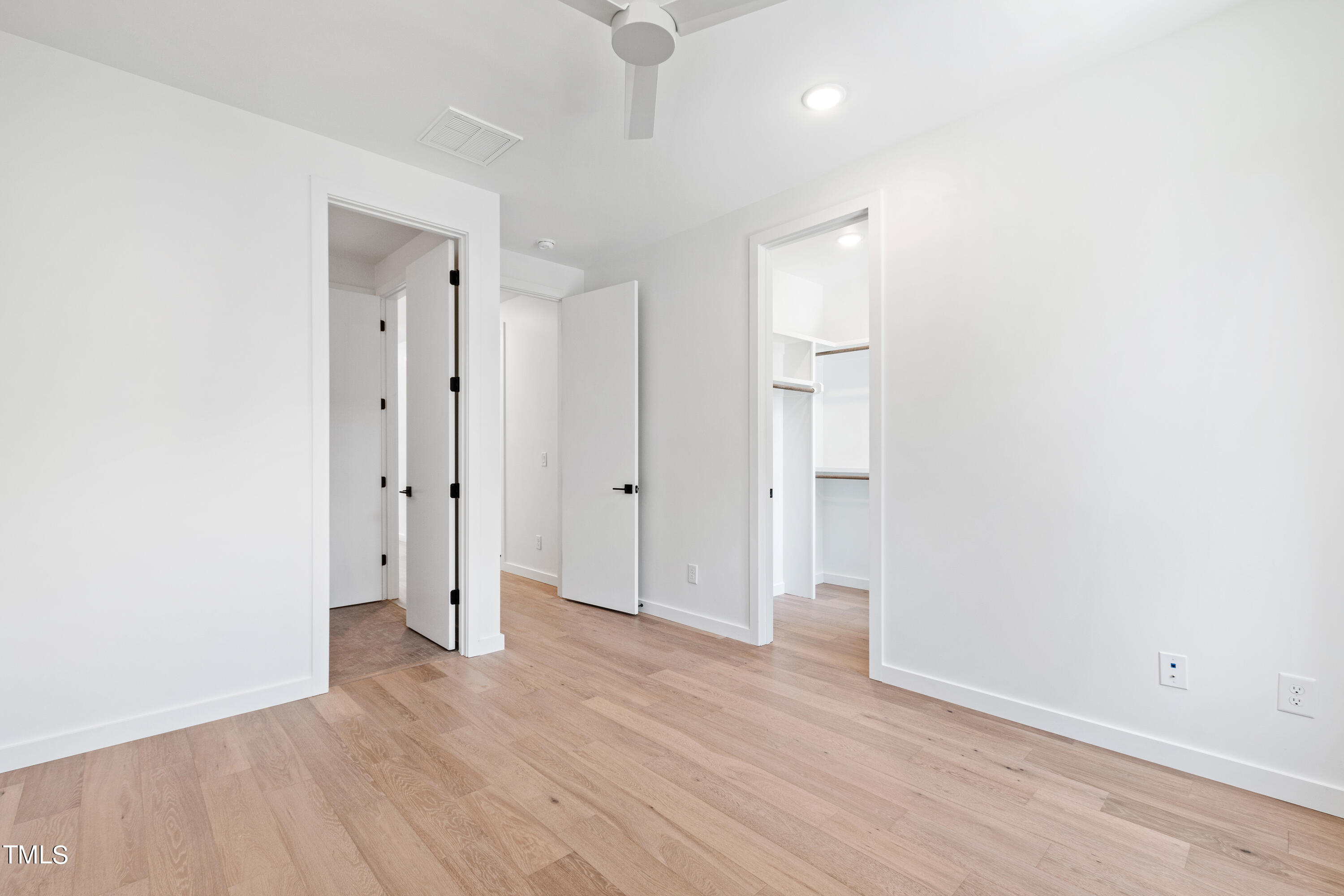 716 Brighton Road, Unit 102 Raleigh, NC 27610 - Photo 56 of 78 a view of an empty room with wooden floor