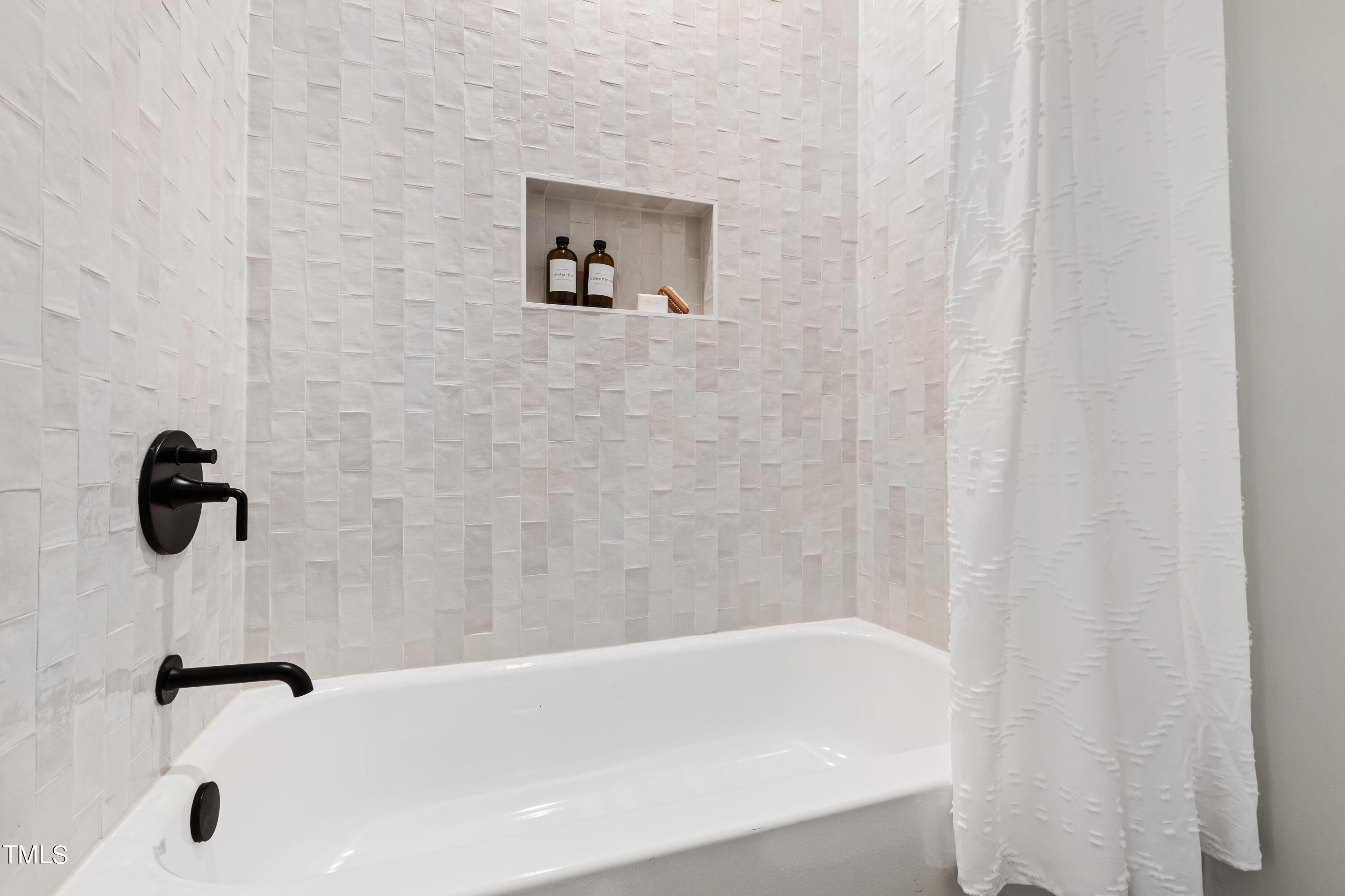 716 Brighton Road, Unit 102 Raleigh, NC 27610 - Photo 67 of 78 a bathroom with a bathtub