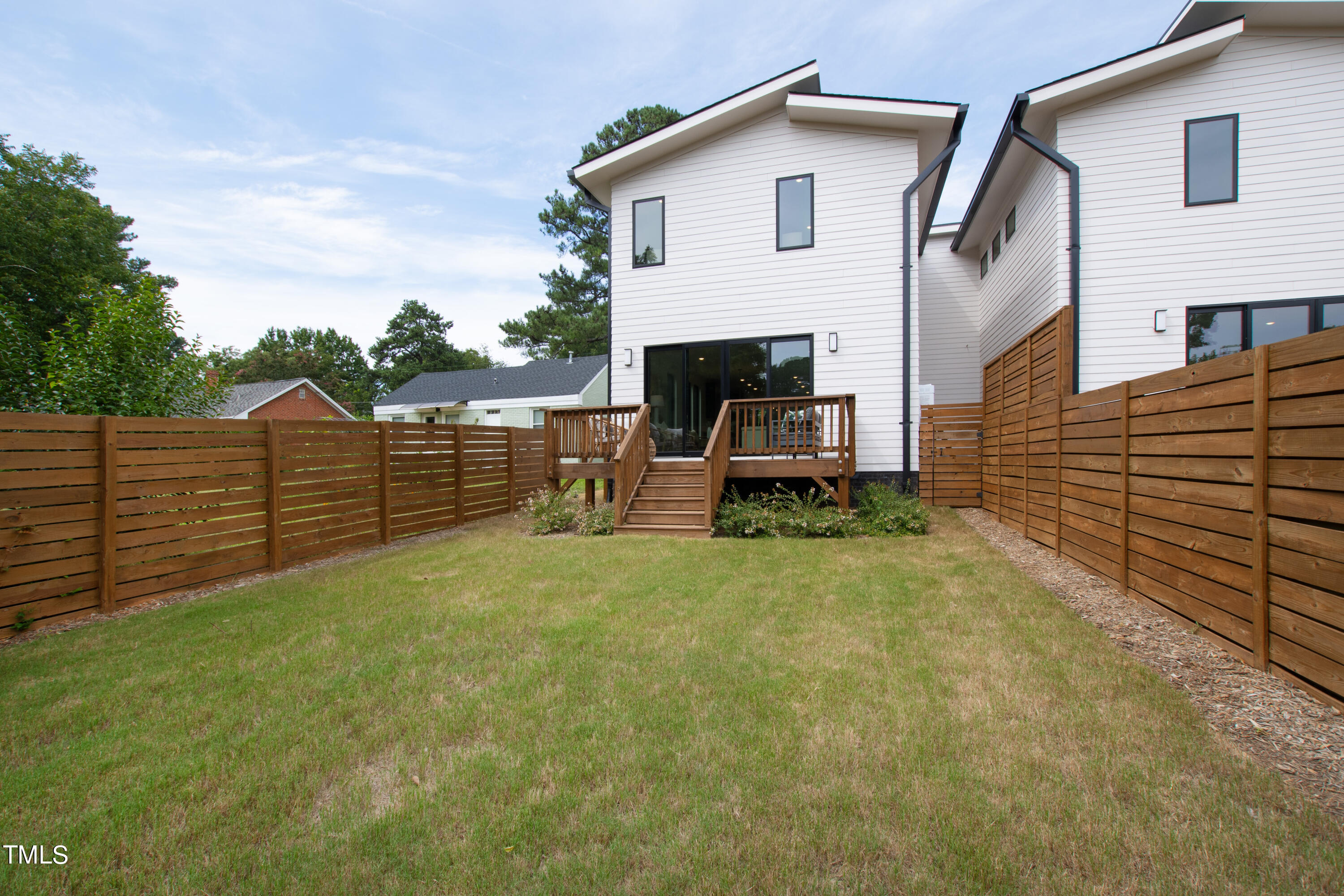716 Brighton Road, Unit 102 Raleigh, NC 27610 - Photo 75 of 78 a view of a backyard with sitting area