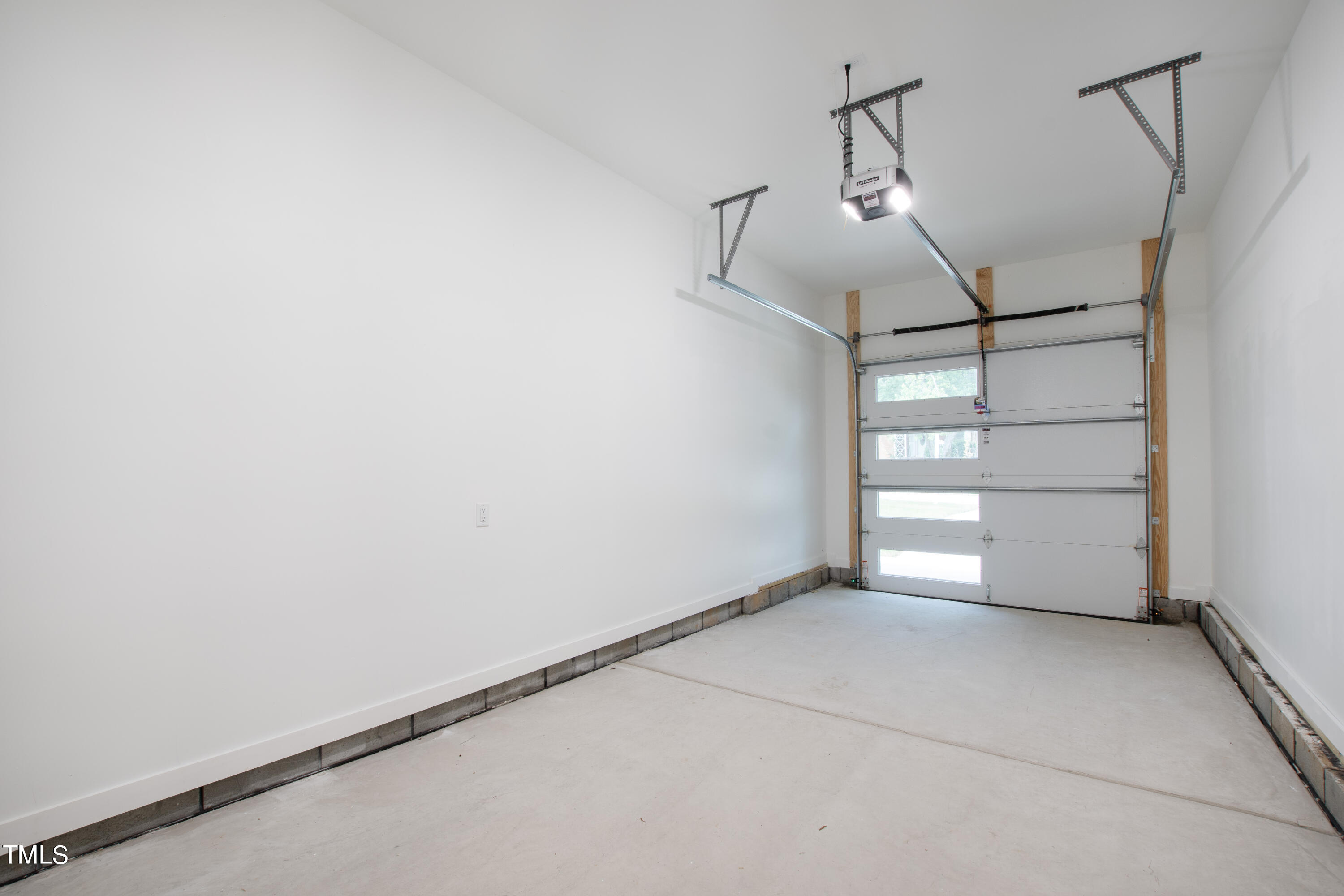 716 Brighton Road, Unit 102 Raleigh, NC 27610 - Photo 76 of 78 a view of a room with racks on the wall