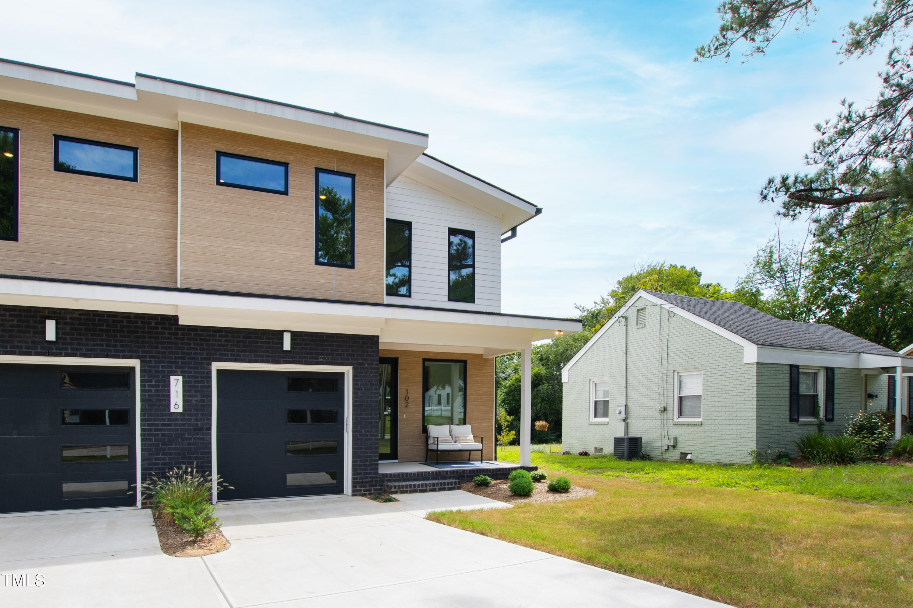 716 Brighton Road, Unit 102 Raleigh, NC 27610 - Photo 78 of 78 a view of a house with a yard and plants