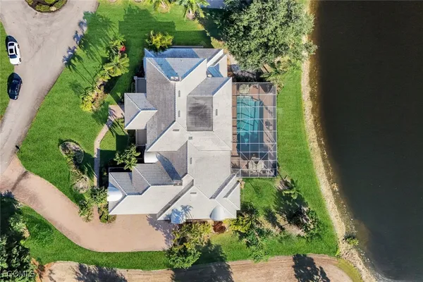 an aerial view of a house with a yard