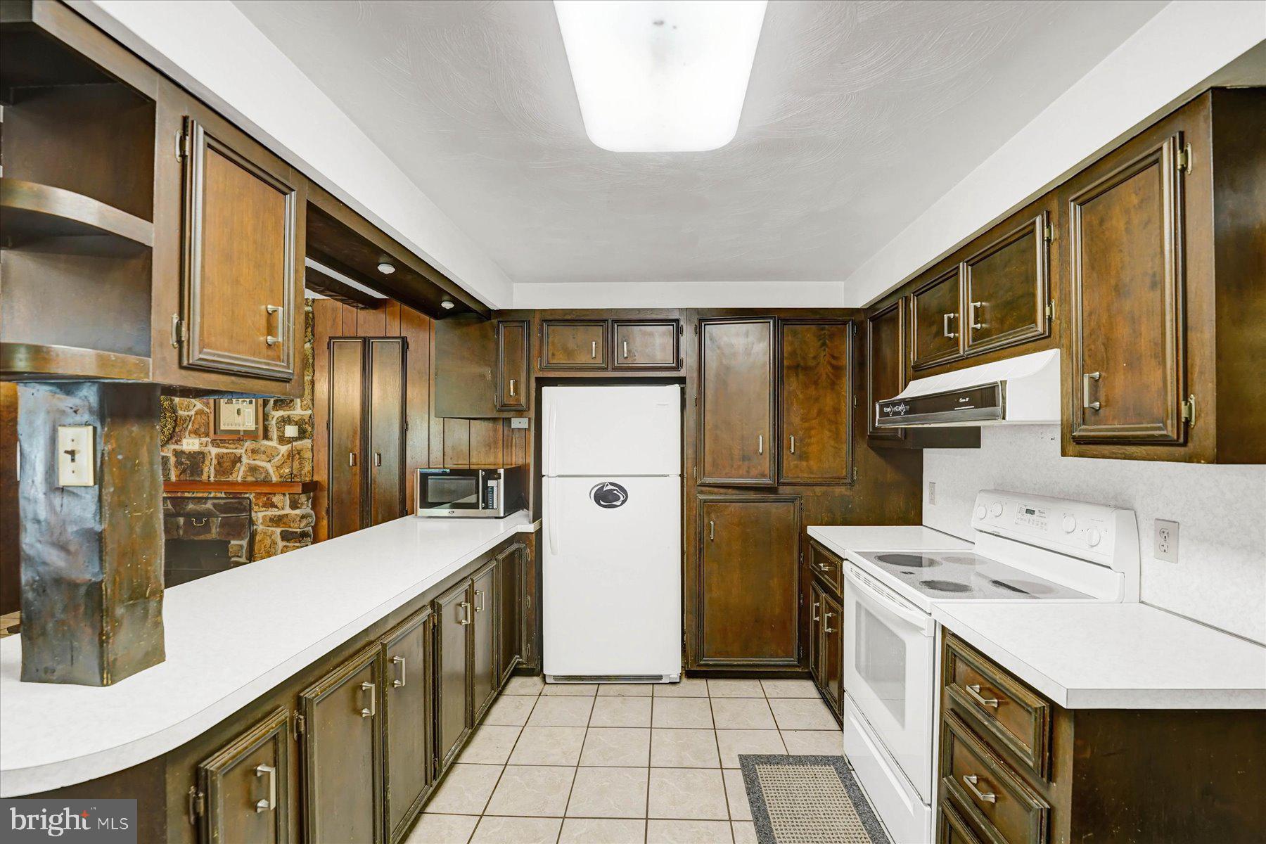 345 Spring Creek Road Bellefonte, PA 16823 - Photo 12 of 45 Charming kitchen with rich wood tones.