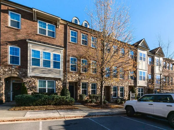 a city street lined with buildings and cars