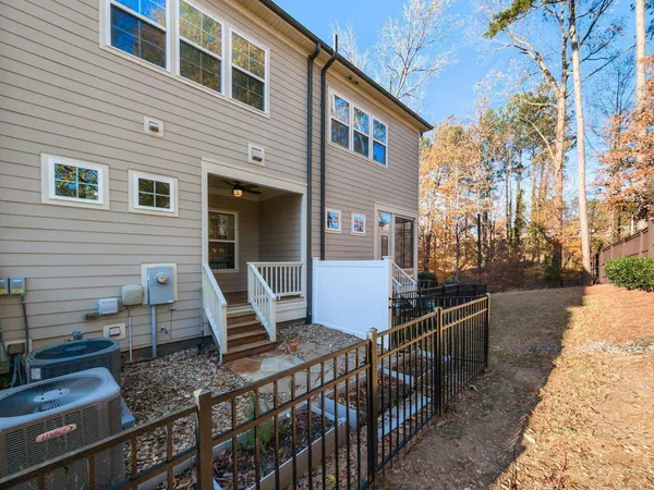 a view of two chairs in the balcony