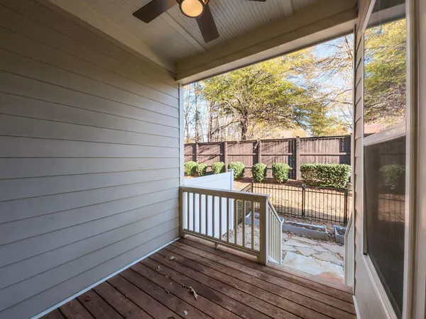 a view of a balcony with wooden floor