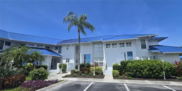 front view of a house with a potted plant