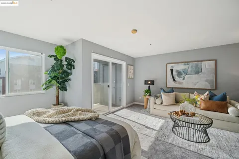 a bedroom with a bed and a couch