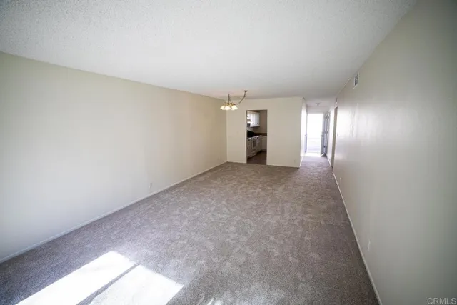 a view of an empty room and window