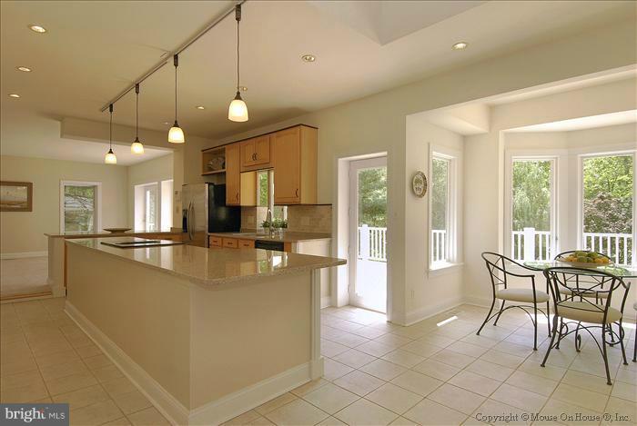 1716 Beulah Road Vienna, VA 22182 - Photo 5 of 30 a view of a dining room with furniture a chandelier and kitchen view