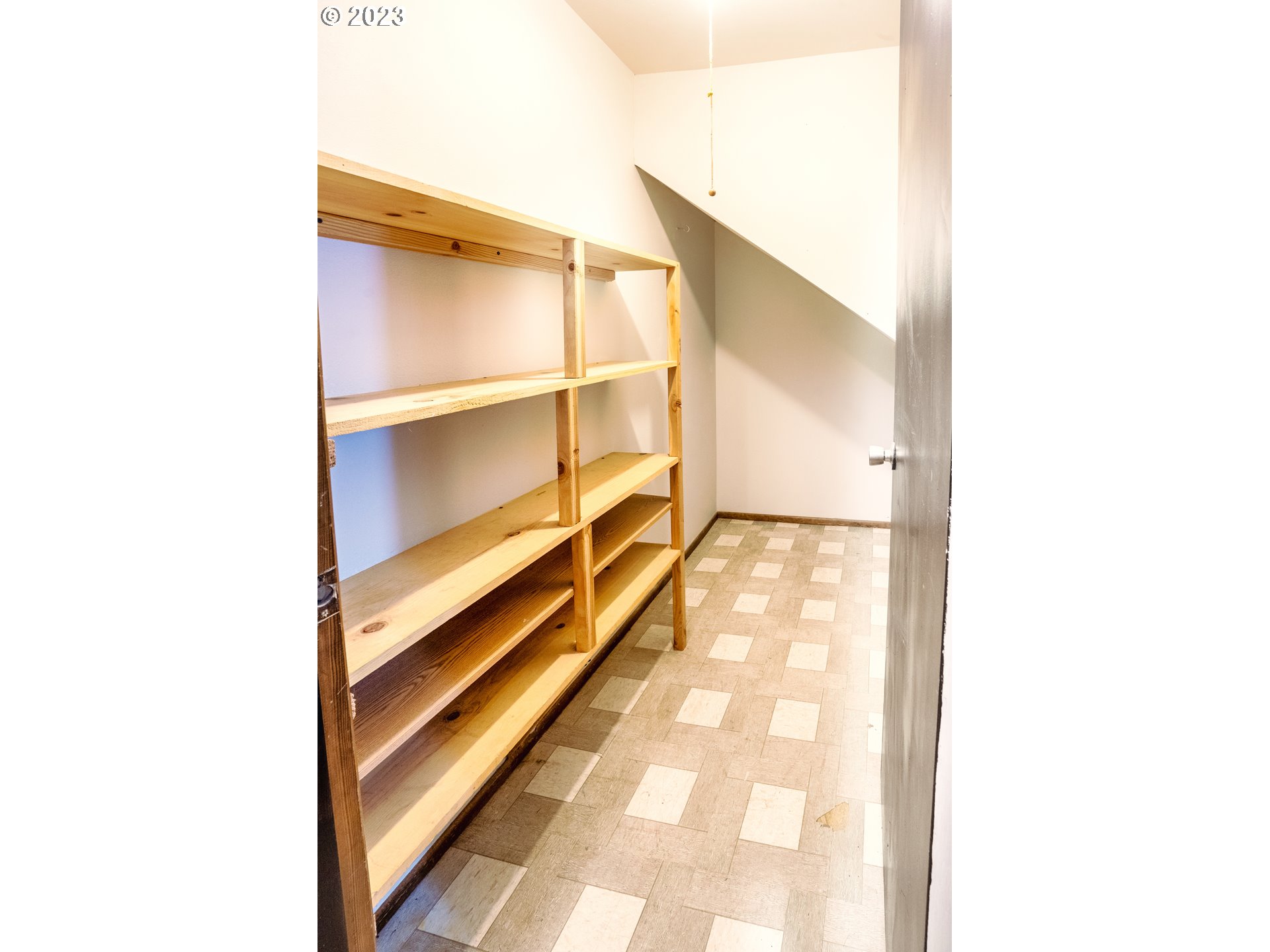 4146 Normandy Way Eugene, OR 97405 - Photo 30 of 48 a view of a hallway with wooden floor