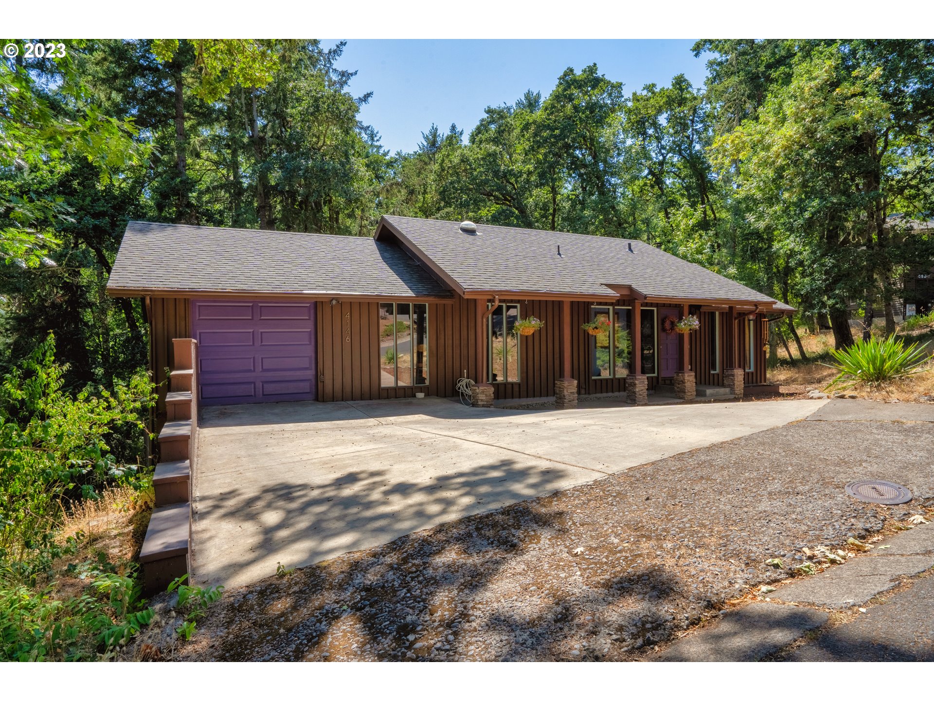 4146 Normandy Way Eugene, OR 97405 - Photo 3 of 48 a front view of a house with a garden