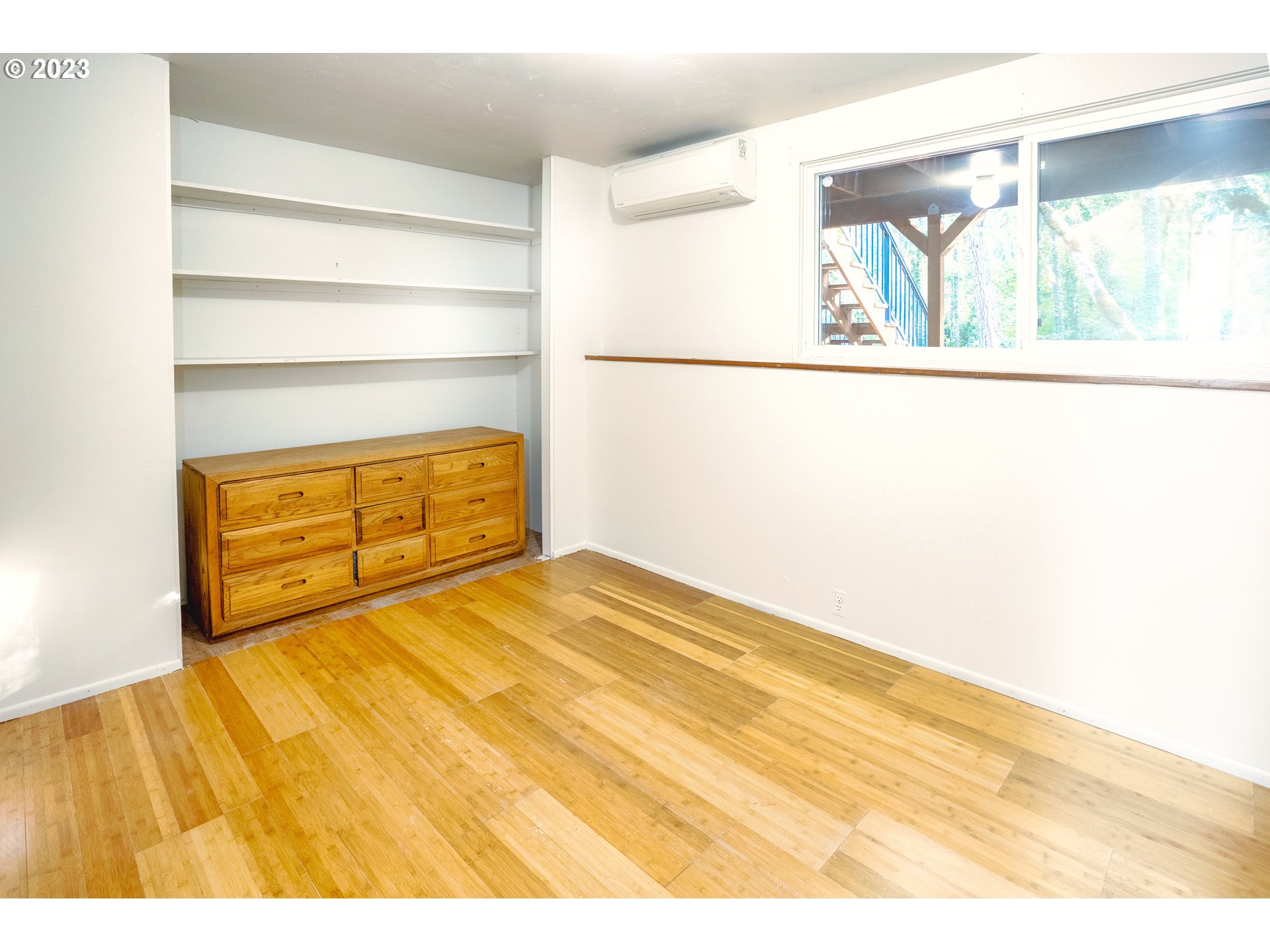 4146 Normandy Way Eugene, OR 97405 - Photo 31 of 48 a bedroom with a bed and a painting on the wall