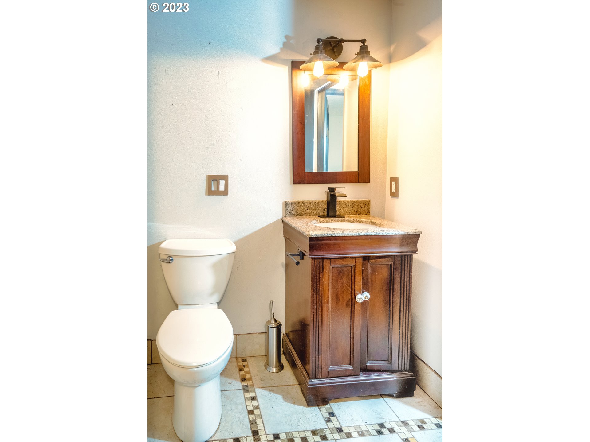 4146 Normandy Way Eugene, OR 97405 - Photo 37 of 48 a bathroom with a toilet sink and mirror