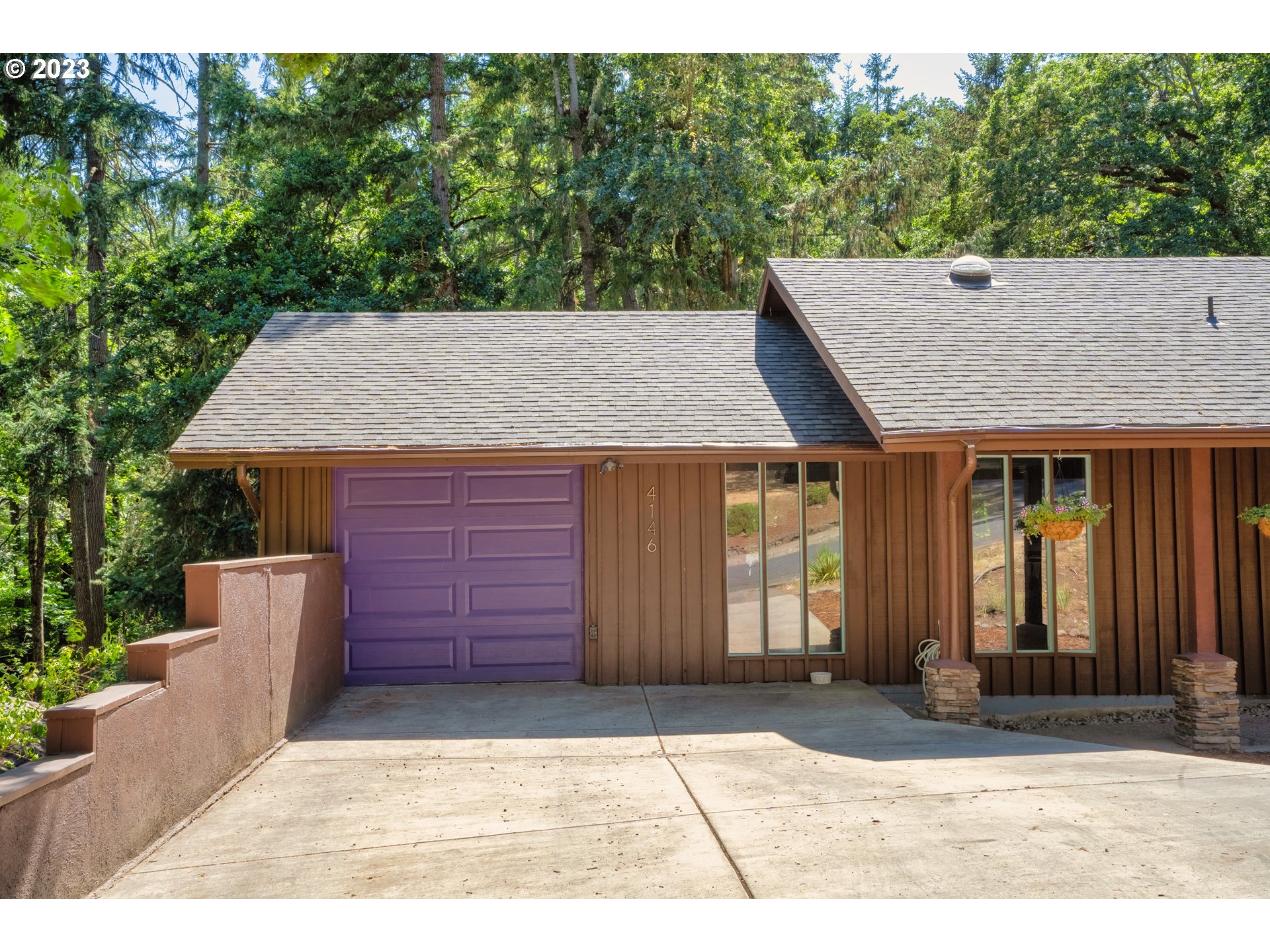 4146 Normandy Way Eugene, OR 97405 - Photo 4 of 48 a front view of a house with a yard