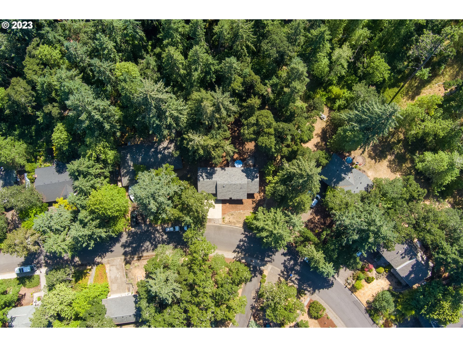 4146 Normandy Way Eugene, OR 97405 - Photo 47 of 48 a view of a garden with a building