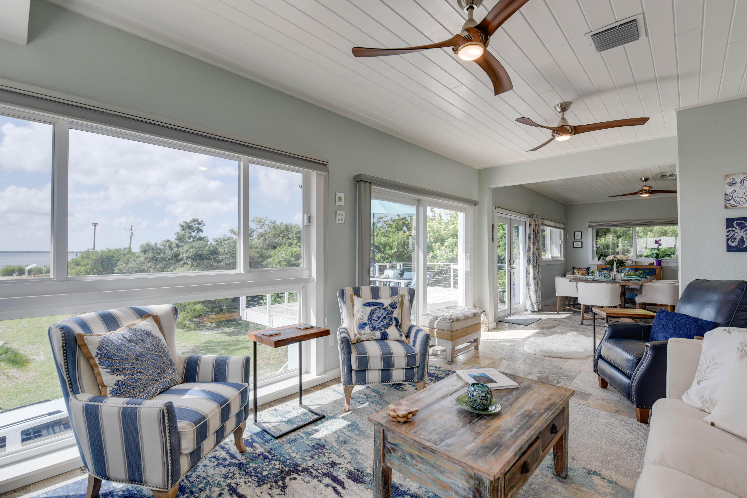 4670 Dorn Road Summerland Key, FL 33042 - Photo 8 of 42 a living room with furniture large windows and wooden floor