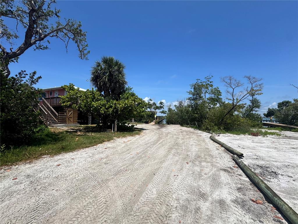 8992 Seagrape Lane Boca Grande, FL 33921 - Photo 19 of 28 a view of a backyard of a house