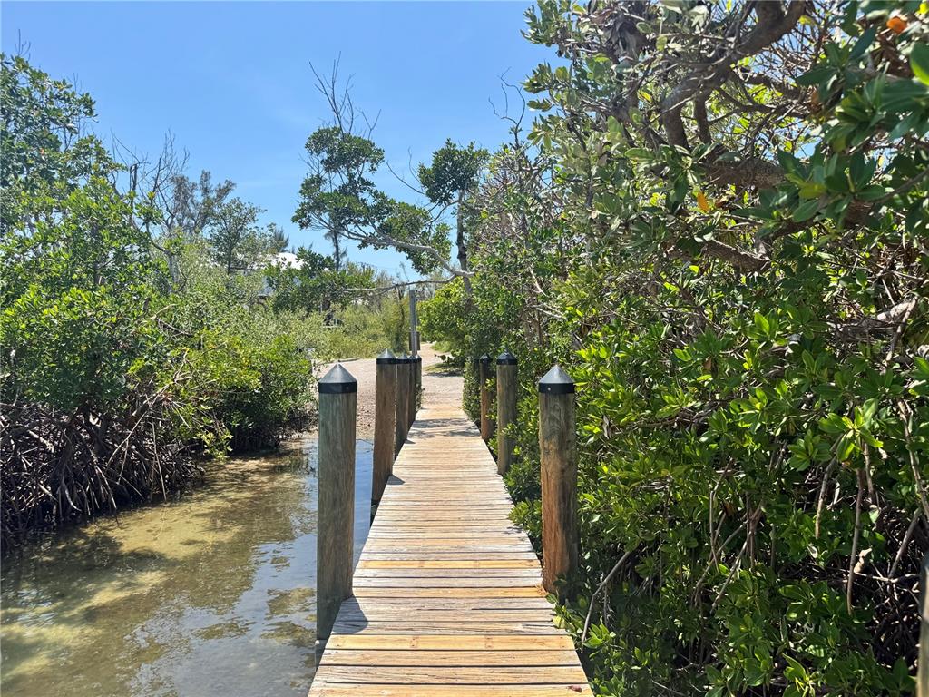 8992 Seagrape Lane Boca Grande, FL 33921 - Photo 4 of 28 a view of a pathway of a building